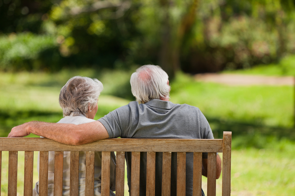 elderly couple on a park bench
